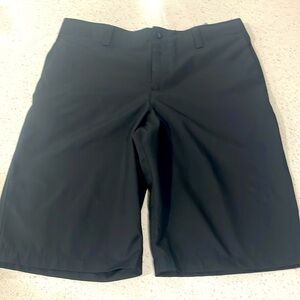 Boys black Under Armour golf shorts. Size 16. Like new.